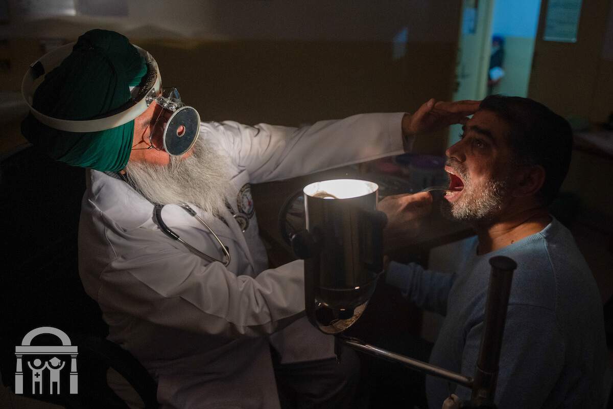 ENT checking throat in dark light at Guru Nanak Mission Hospital in Dhahan Kaleran near Banga in Shaheed Bhagat Singh Nagar district