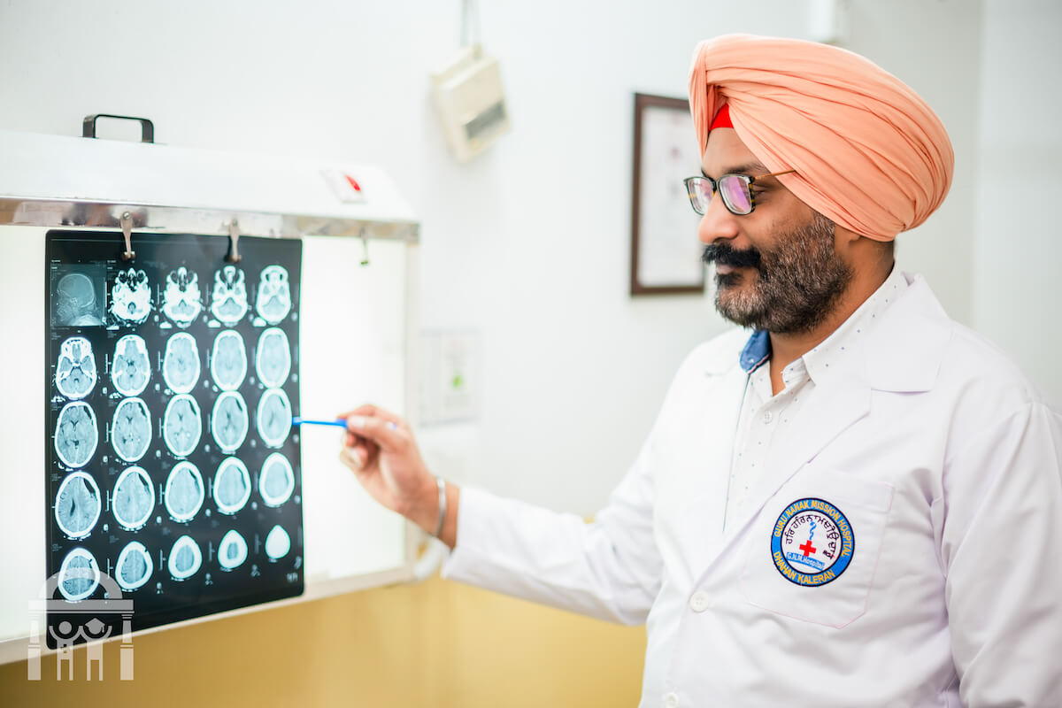 Neurosurgeon examining brain scans at Guru Nanak Mission Hospital Dhahan Kaleran near Banga and Phagwara in Punjab