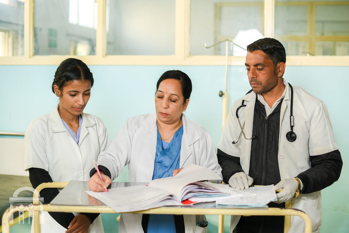 Dietician with nurses updating patient charts in hospital at Guru Nanak Mission Hospital in Dhahan Kaleran near Banga